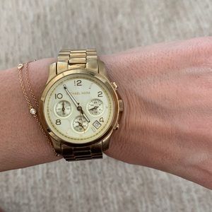 Gold MIchael Kors watch.